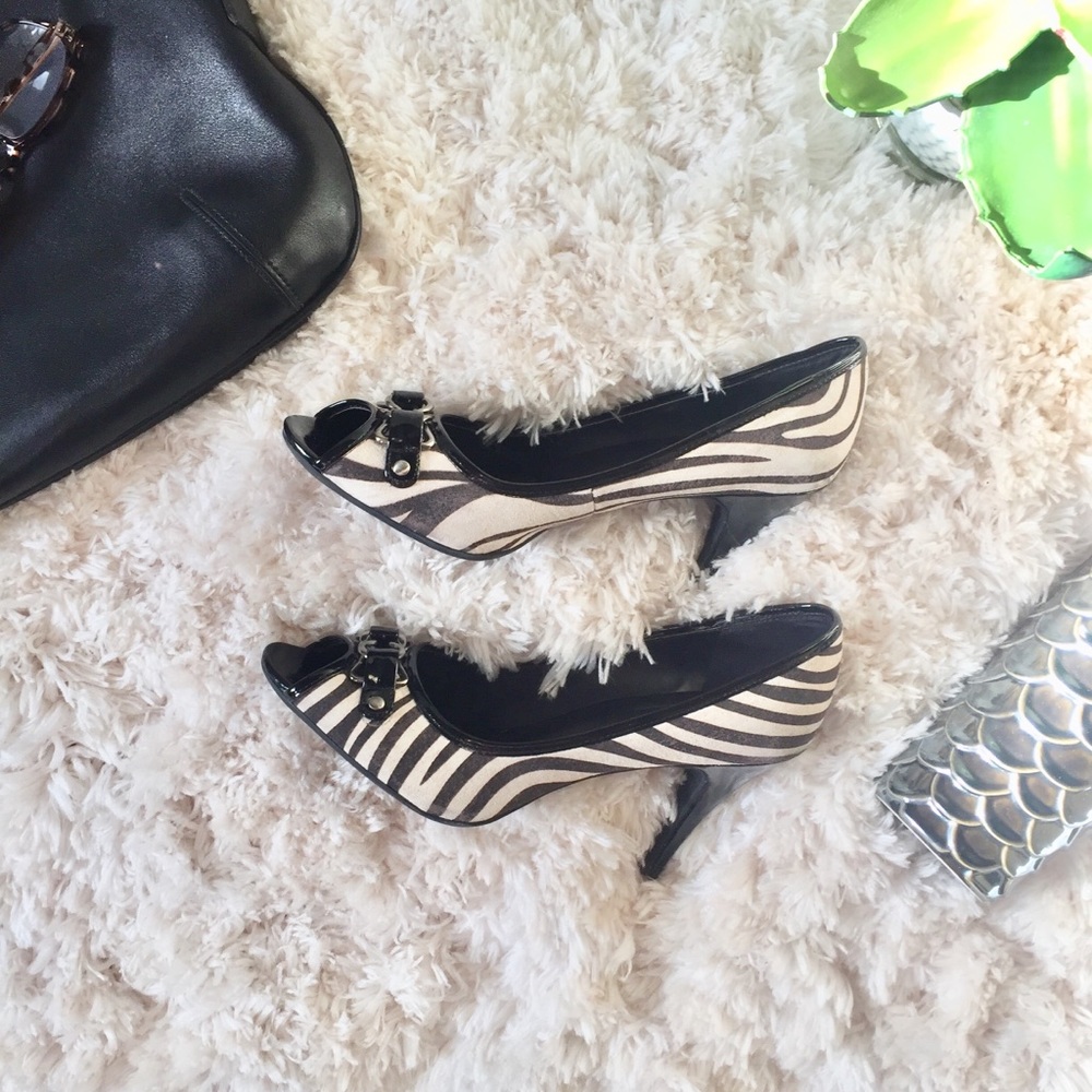 Peep-toe zebra print heels with buckle accent